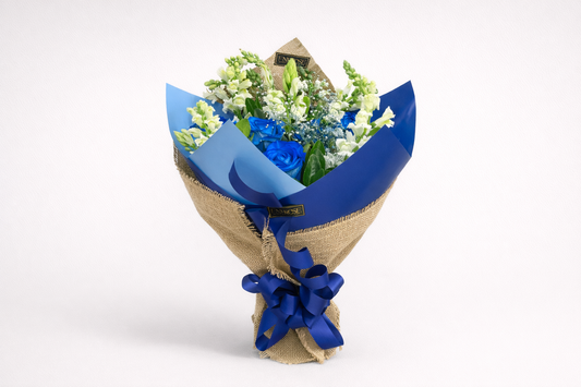 Blue bouquet with 6 roses and snapdragons.