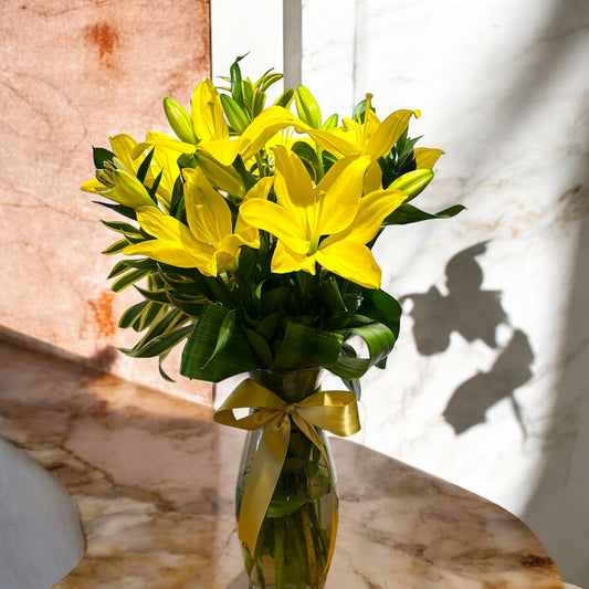 Yellow Lilies Arrangement - Shine and Sophistication in a Glass Vase