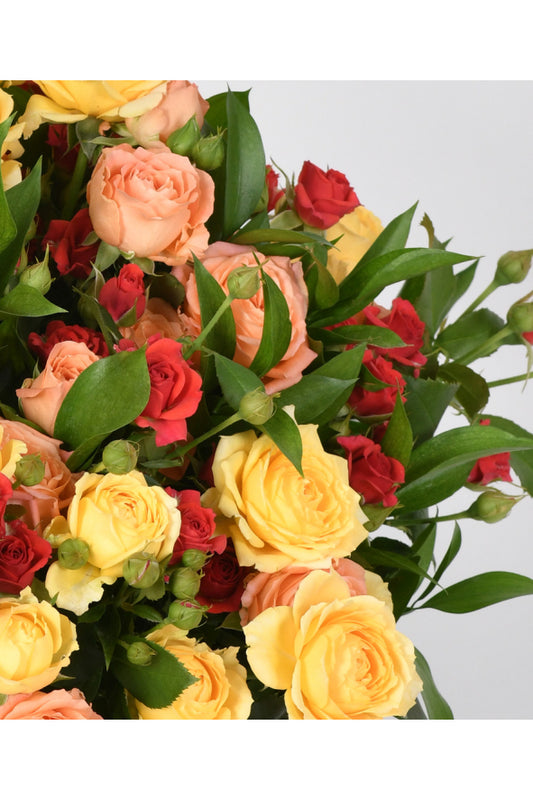 Arrangement of Mini Roses in a Glass Vase - Elegance and Soft Colors