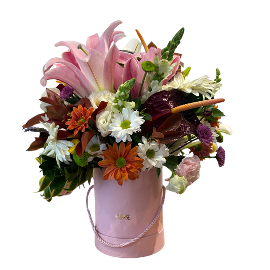Arrangement of Lilies and Assorted Flowers in a Pink Box - Charm and Delicacy