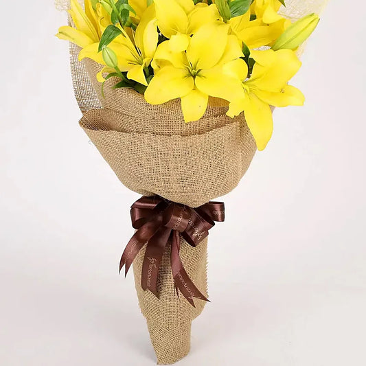 Bouquet of Yellow Lilies Wrapped in Burlap