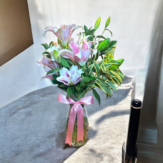 Elegant Arrangement of Pink Lilies - A Touch of Sophistication in a Glass Vase