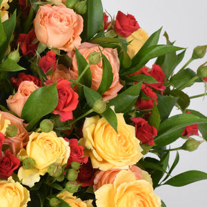 Arrangement of Mini Roses in a Glass Vase - Elegance and Soft Colors